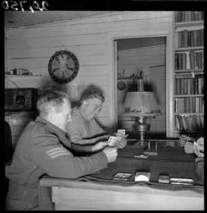New Zealand soldiers playing cards while off duty, Coast Watching Station, Oteranga Bay, Wellington, during World War 2