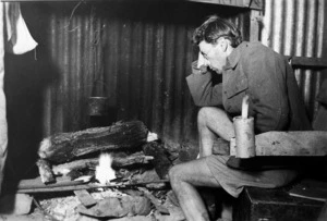 Gold miner Don Harvey, in a tin hut in Boots Road, Golden Bay