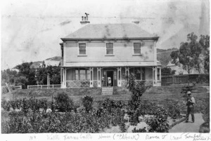 Andersen, Johannes Carl, 1873-1962:One mounted photograph of Walter Turnbull's house, fronting on to Bowen Street and The Terrace, Wellington