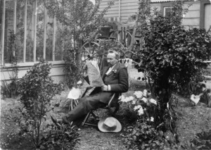 Man in the back garden at the residence of Louis P Christeson at 213 Willis Street, Wellington
