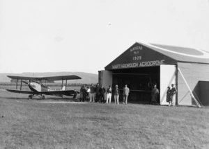 Gipsy Moth aeroplane and unidentified group at Martinborough Aerodrome