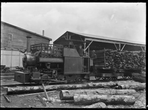 Timber locomotive hauling a load of sawn timber at an unidentified sawmill.