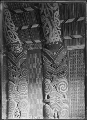 Carved panels and tukutuku panels in the Maori meeting house at Parawai, Thames, in 1917