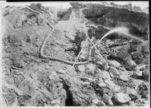 Reverend George Hunter McNeur, and an unidentified Chinese gold miner, alongside a sluicing hose in Naseby, Otago