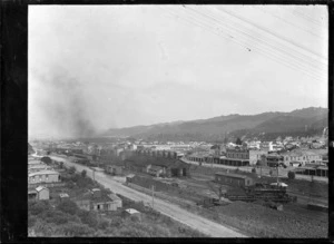 View looking over Taumarunui Railway Station and railway yards in the foreground, with the township beyond.