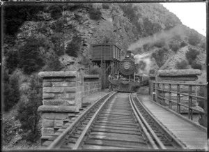 "Ub" class steam locomotive no. 336 (4-6-0 type), approaching a bridge.