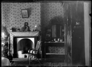Interior view of a bedroom, circa 1900