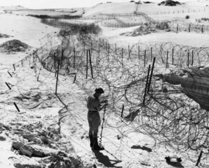 World War II soldier and barbed wire, in the defended locality of the Western Desert, Egypt