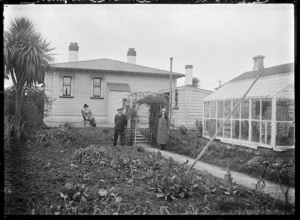View of the backyard of number 9 Baker Street, Caversham, Dunedin, with the photographer Albert Percy Godber, his wife Laura, and his daughter Phyllis.