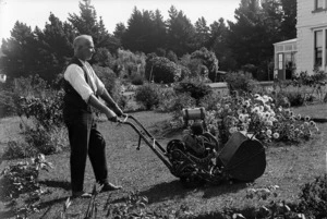 Mr Tasker using a motor mower