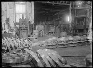 Interior view of one of the Hillside Railway Workshops, Dunedin, showing the manufacture of car and wagon wheels.