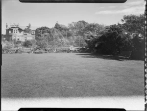 View of house and tennis court across large lawn, Homewood, Karori, Wellington