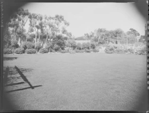 Buildings and tennis court across large lawn, Homewood, Karori, Wellington