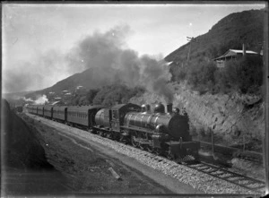 Class Ab steam locomotive with passenger train passing Mangapehi