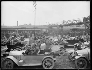 Part 1 of a 2 part panorama showing cars and soldiers outside the Christchurch Railway Station
