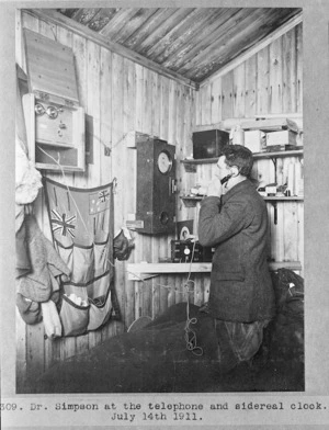 George Simpson on the telephone, timing the occultation of Jupiter during the British Antarctic Expedition of 1911-1913