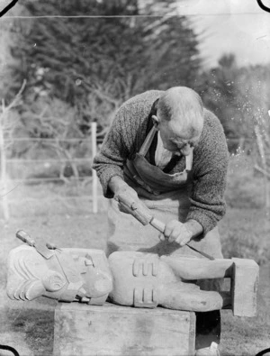 Albert Percy Godber at work on a carving in the Maori tradition, circa 1930