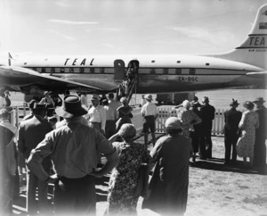 Tasman Empire Airways Limited aircraft, and group waiting for arriving passengers, Harewood Airport, Christchurch