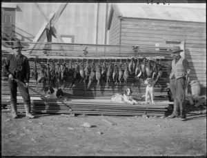 Hunters with dead pheasants