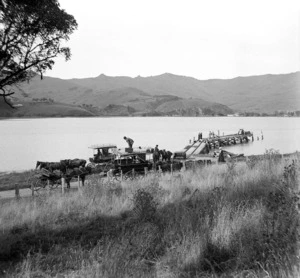 Akaroa, showing coaches by a wharf
