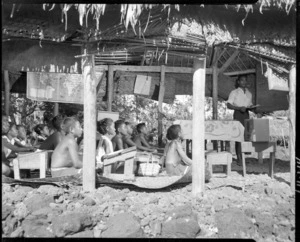 A very small Samoan village school listening to an educational broadcast