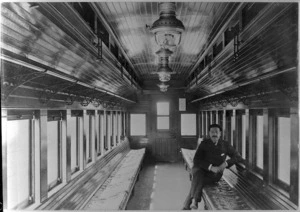 Interior of a railway carriage showing Albert Percy Godber