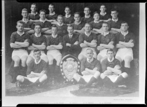 Unidentified rugby team with shield, including R E Diedrich, J R Page, N Ball, O P Price, D E Oliver - Photograph taken by Standish and Preece