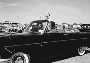 Her Majesty the Queen Mother waves from a car at the civic welcome in McLean Park, Napier