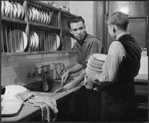 Creator unknown: Photograph of two young men washing dishes, Wellington City Mission hostel
