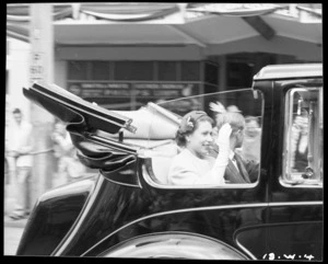 Her Majesty Queen Elizabeth II and Philip, Duke of Edinburgh, travelling in an open topped car in Wellington