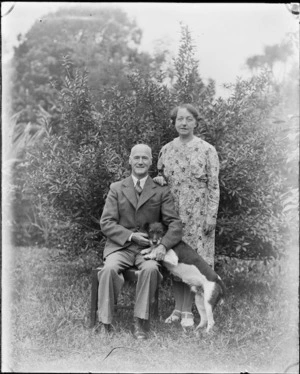 An unidentified man and woman, photographed in a garden