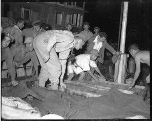 New Zealand patrol of A Company, 22 Battalion, searching a Japanese vessel