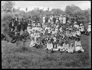 Men, women, and children, at a picnic