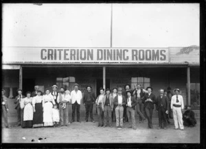 Criterion Dining Rooms, Charles Packham, proprietor, with large group of men standing outside