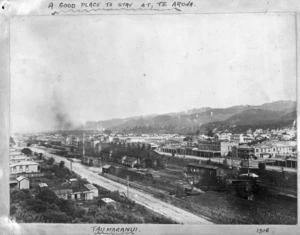 View looking over Taumarunui Railway Station and railway yards in the foreground, with the township beyond.