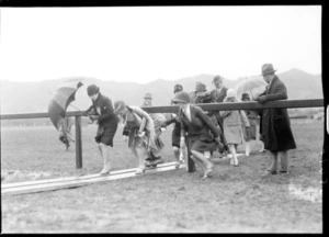 Arrival of the Southern Cross at Wellington, possibly Trentham. Group of people crossing the grounds