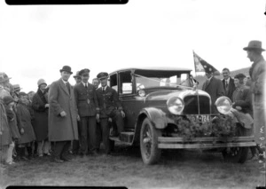 Arrival of the Southern Cross at Wellington, possibly Trentham, crowd with car decorated for the occasion