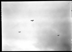 Arrival of the Southern Cross at Wellington, possibly Trentham. Three planes in the sky
