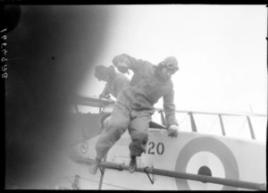 Arrival of the Southern Cross at Wellington, possibly Trentham. Crew alighting from plane