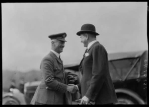 Arrival of the Southern Cross at Wellington, possibly Trentham. Aviator, possibly C Kingsford Smith, shaking hands with J G Coates (Rt Hon)