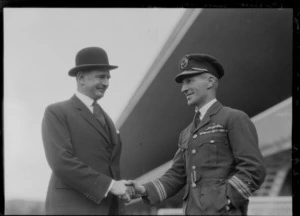 Arrival of the Southern Cross at Wellington, possibly Trentham. C Kingsford Smith shaking hands with J G Coates (Rt Hon)