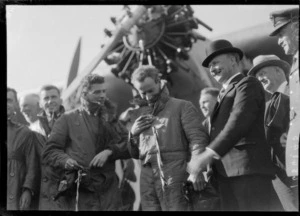 Arrival of the Southern Cross at Christchurch. Crew and dignitaries, plane in background