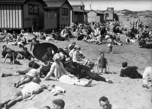Crowds sunbathing on Lyall Bay Beach, Wellington