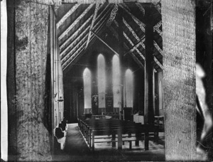 Interior view of Rangiatea Church, showing the Maori designs on the rafters (kowhaiwhai), looking towards the windows behind the altar
