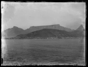 Table Mountain, Lion's Head and Cape Town suburbs Bantry Bay, Clifton, and Camps Bay seen from on board offshore troopship
