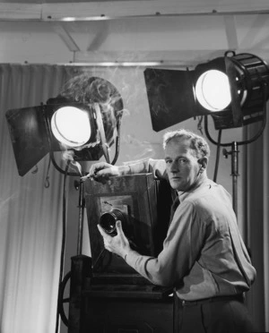 Edward Percival Christensen, with a camera and lights