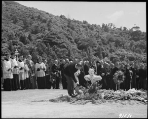 The Duke of Edinburgh laying a wreath at the mass burial after the Tangiwai rail disaster - Photograph taken by E Woollett