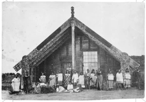 Deveril, Herbert, 1840-1911 : Photograph of Maori group outside Tamatekapua Meeting House, Ohinemutu, Rotorua