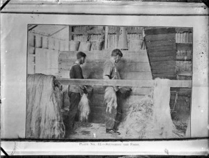 Two flax workers scutching the fibre