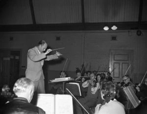 Woollett, E fl 1951 (Photographer) : James Robertson, conducting the National Orchestra